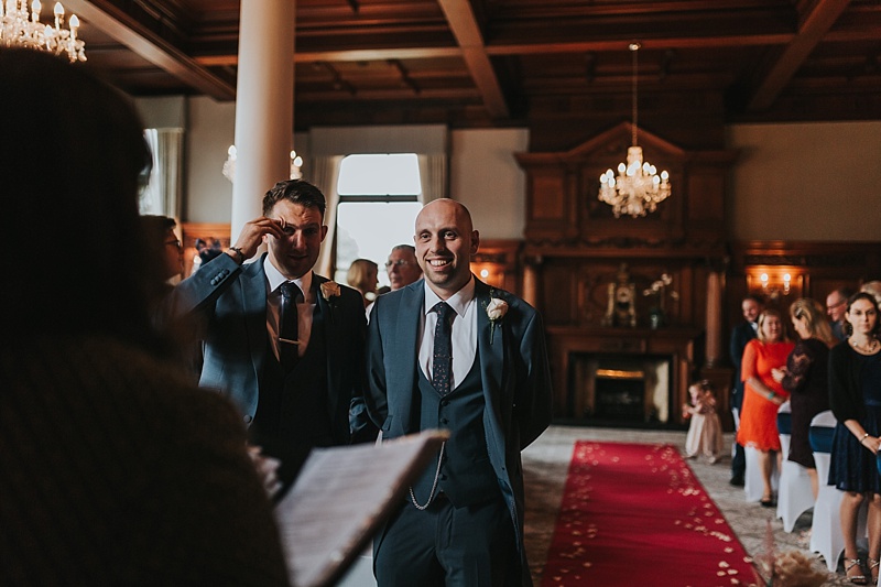 groom waiting for his bride in the oak room of the principal York hotel