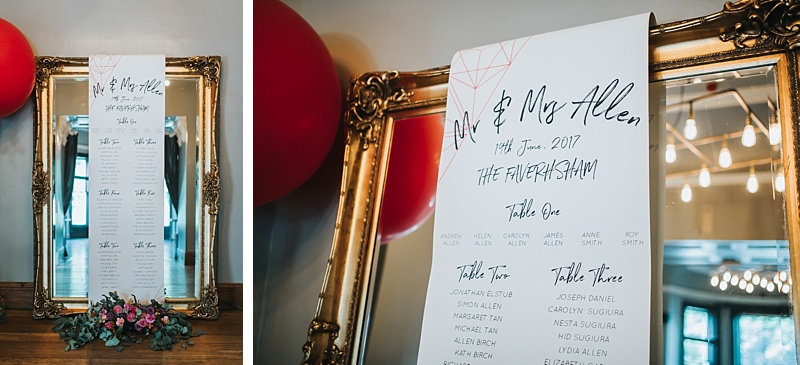 large gold gilt mirror with wedding table plan draped over