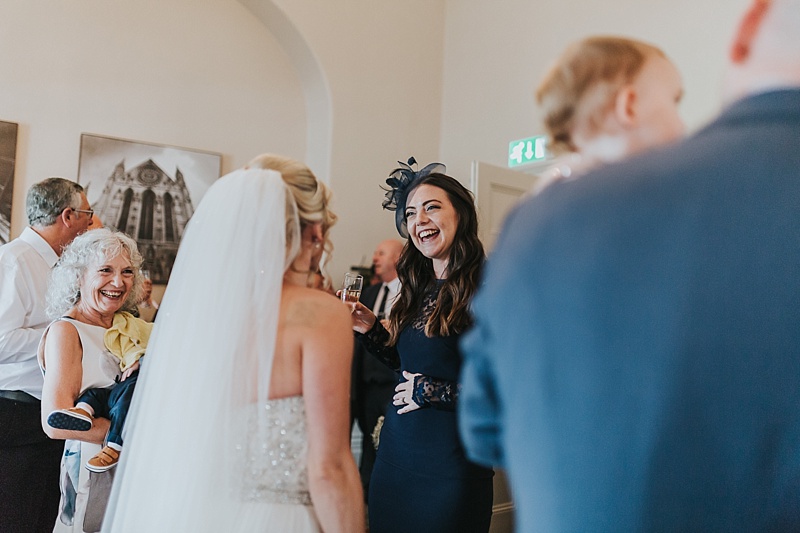 wedding guests laughing