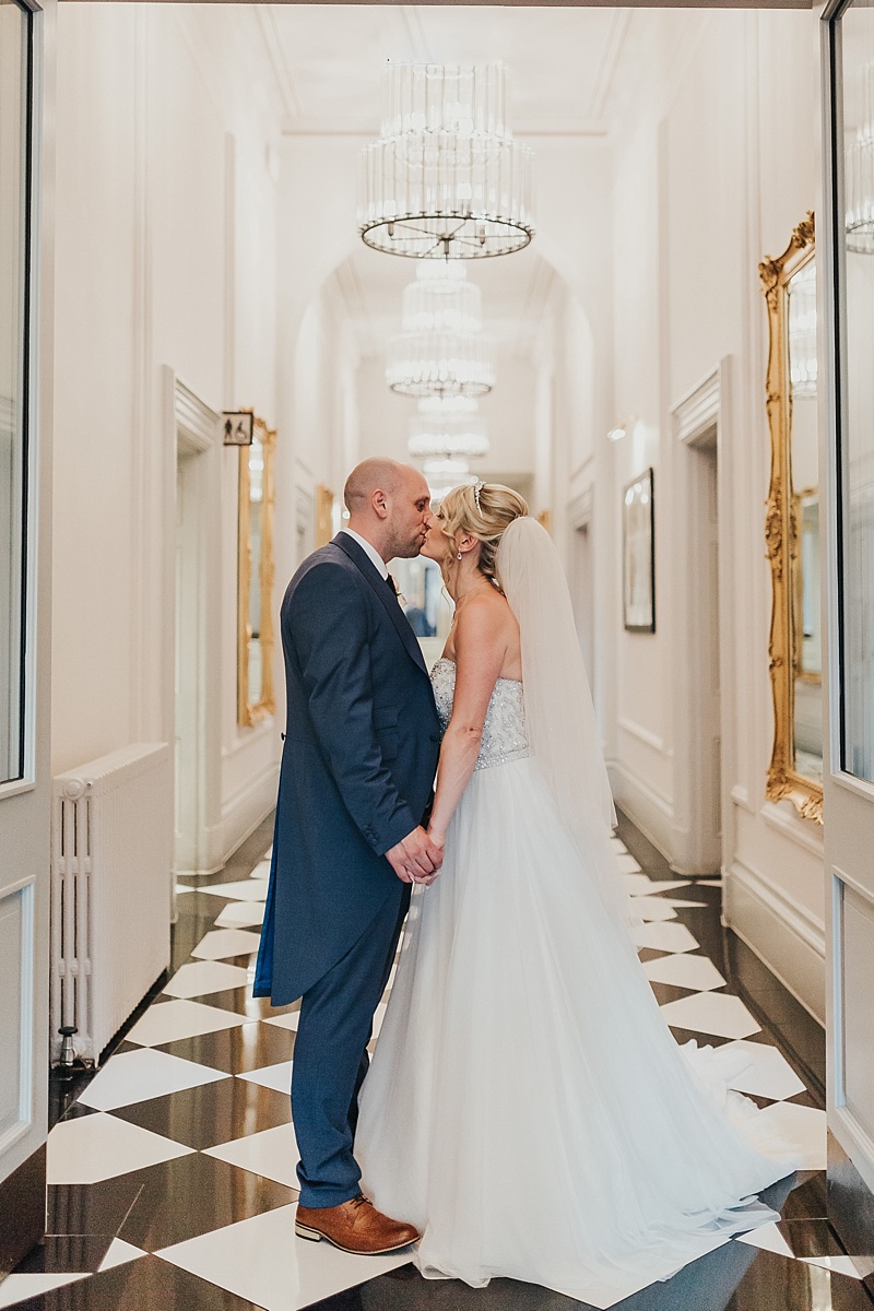 portrait of a bride and groom in the hallway of the principal York wedding venue