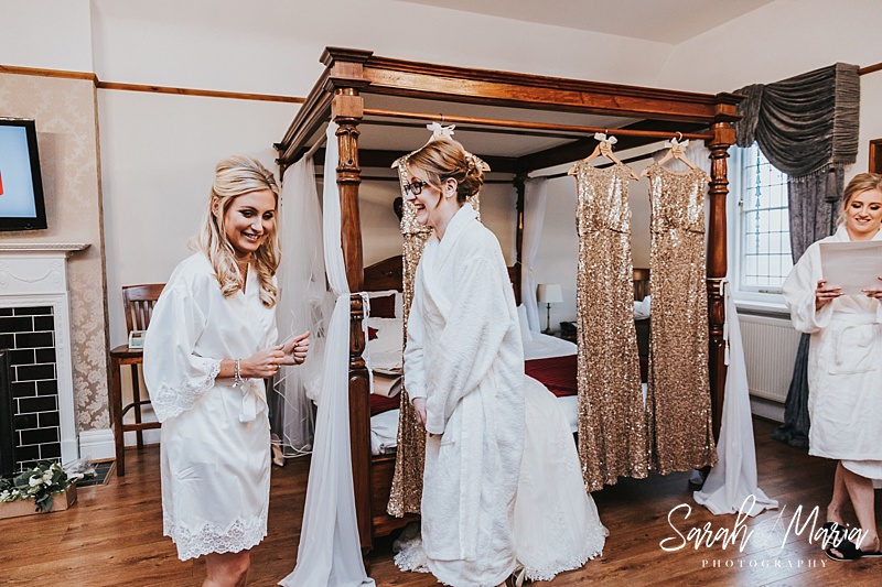 bride laughing with her bridesmaids