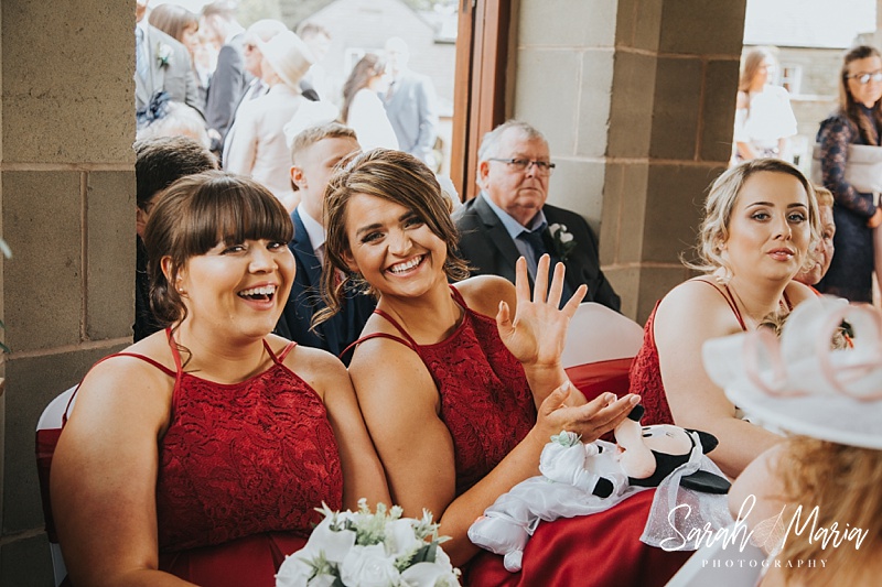candid photograph of bridesmaids smiling