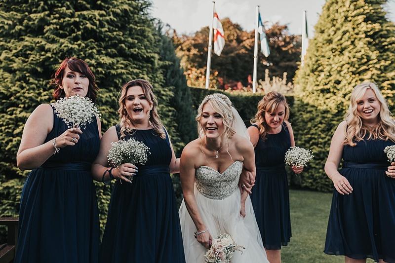 natural shot of a bride and her bridesmaids at a wedding at the principal York