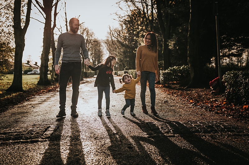 backlit family portrait during autumn