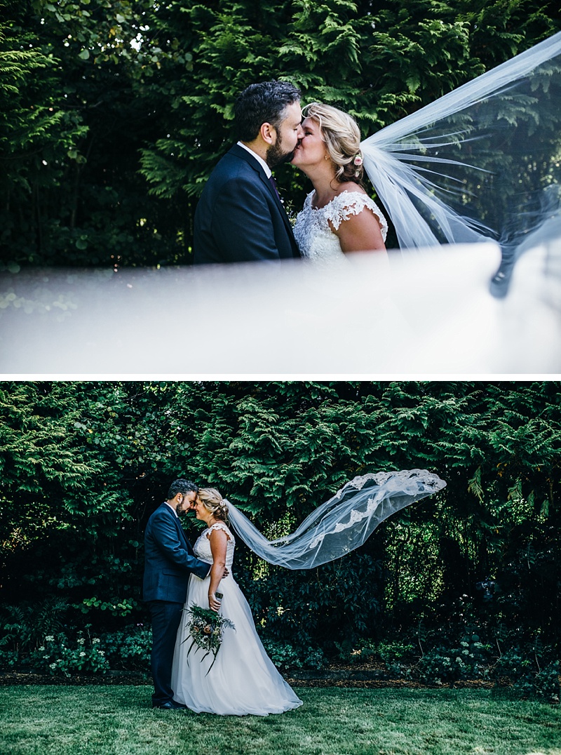 bride and groom portraits with the wind blowing her veil