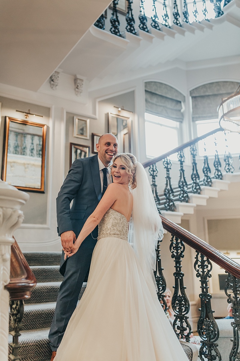 natural shot of bride and groom on the stairs of the principal York hotel