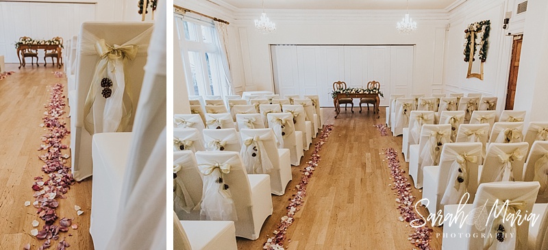 winter wedding ceremony room at west tower. flowers sprinkled on the aisle