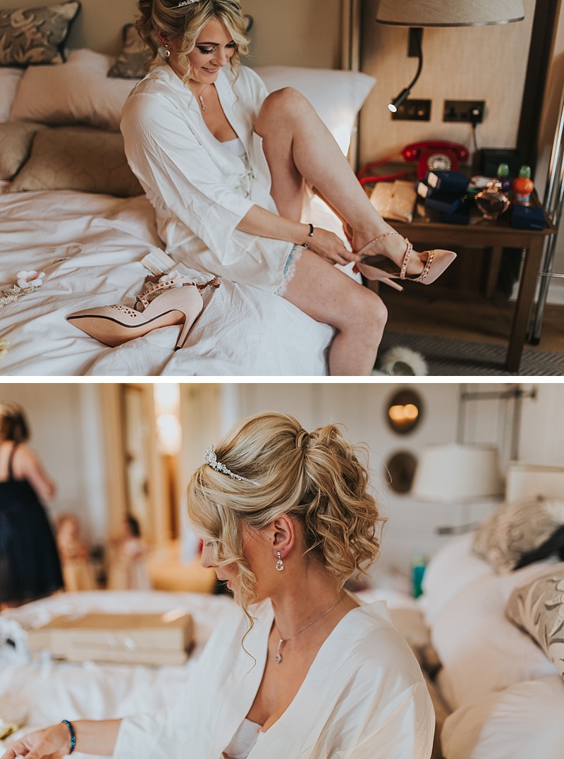 a bride getting ready to get married. Putting her shoes on