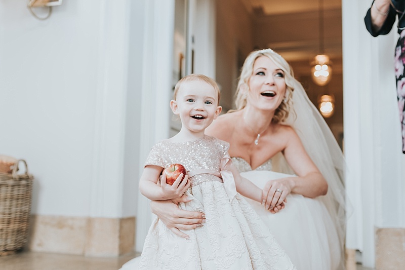 flower girl with her mother the bride on the steps of the principal York hotel
