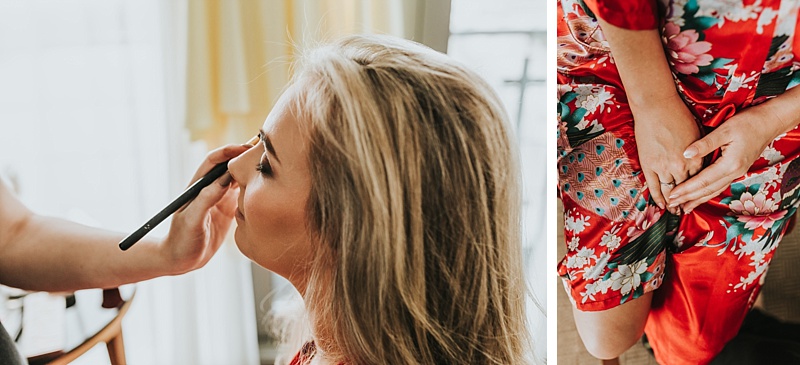 Bride during wedding preparations in a bright silk dressing gown