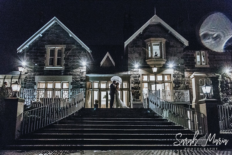 nighttime portrait of a bride and groom at west tower wedding venue