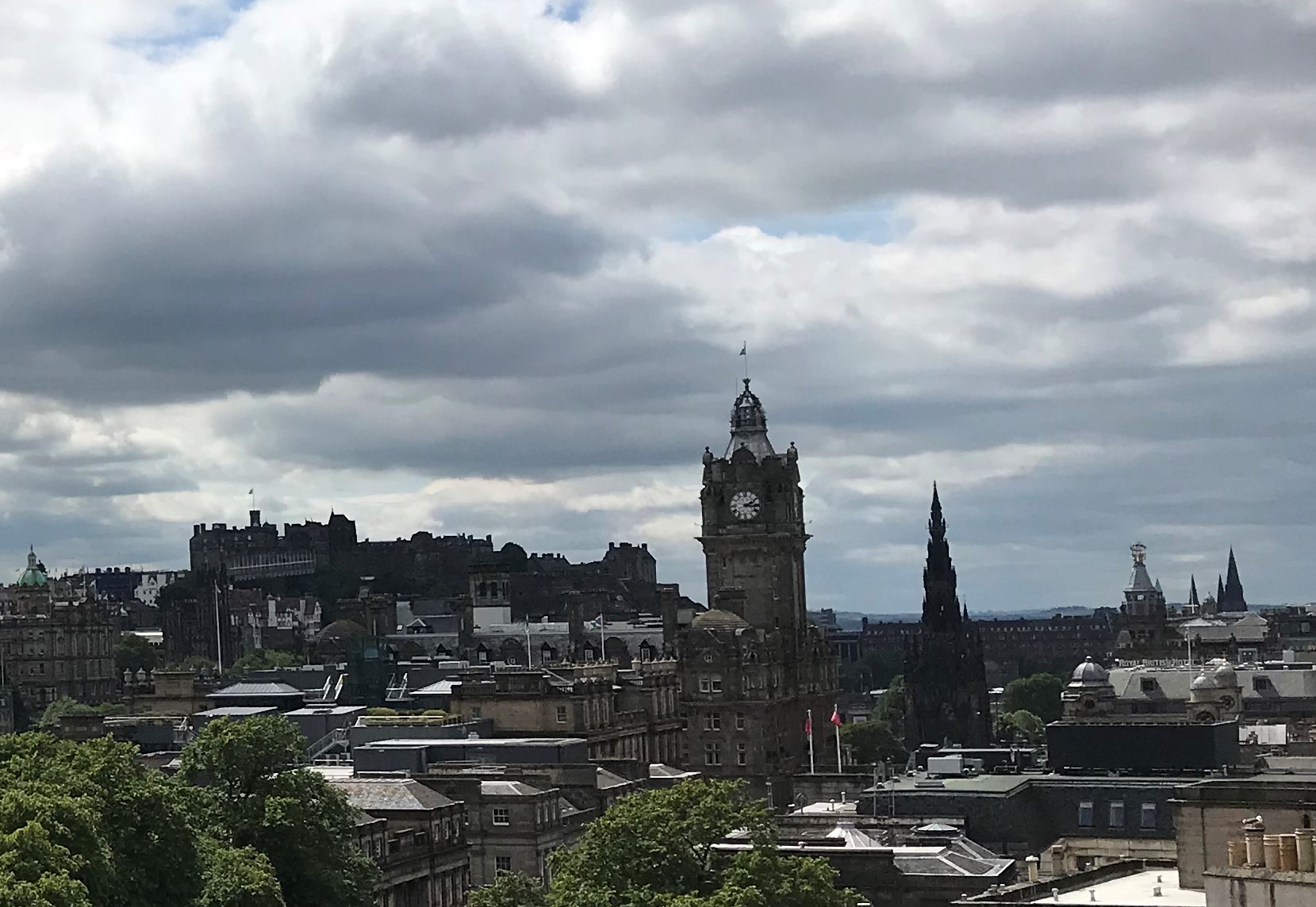 The tower next to the Clock tower is Scott's Monument