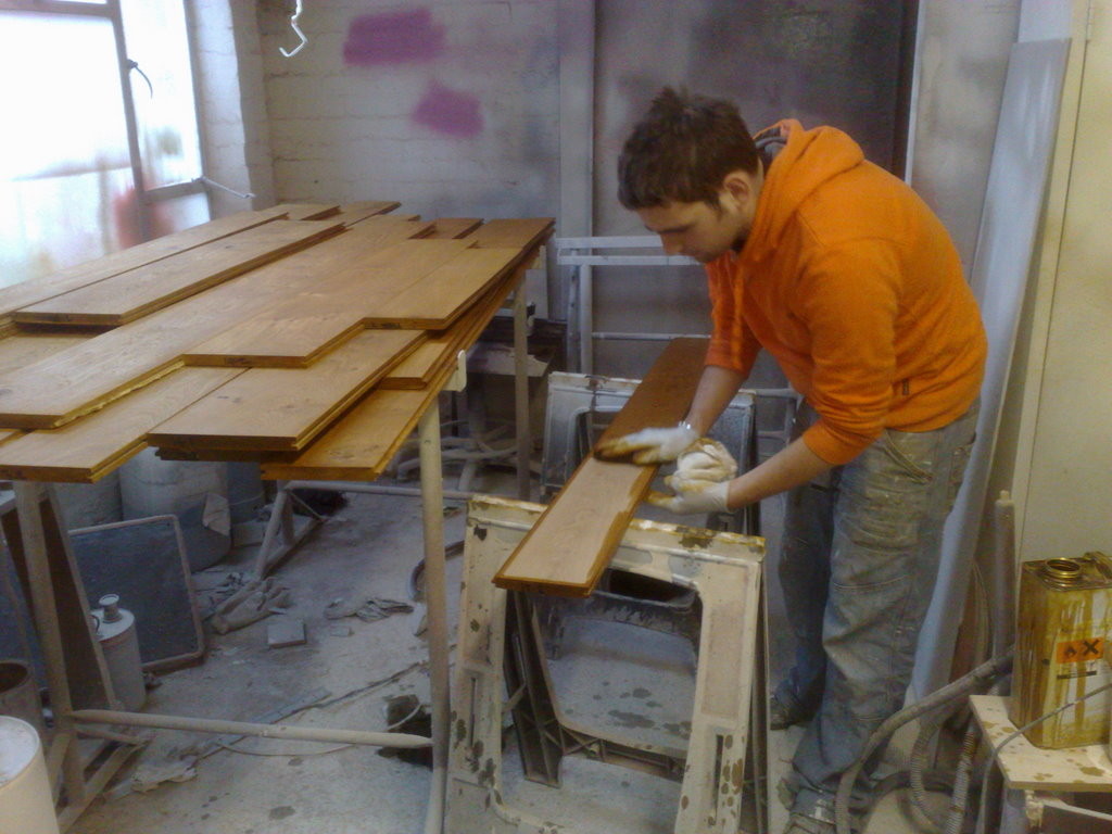 Hand staining pre-fitted floor boards