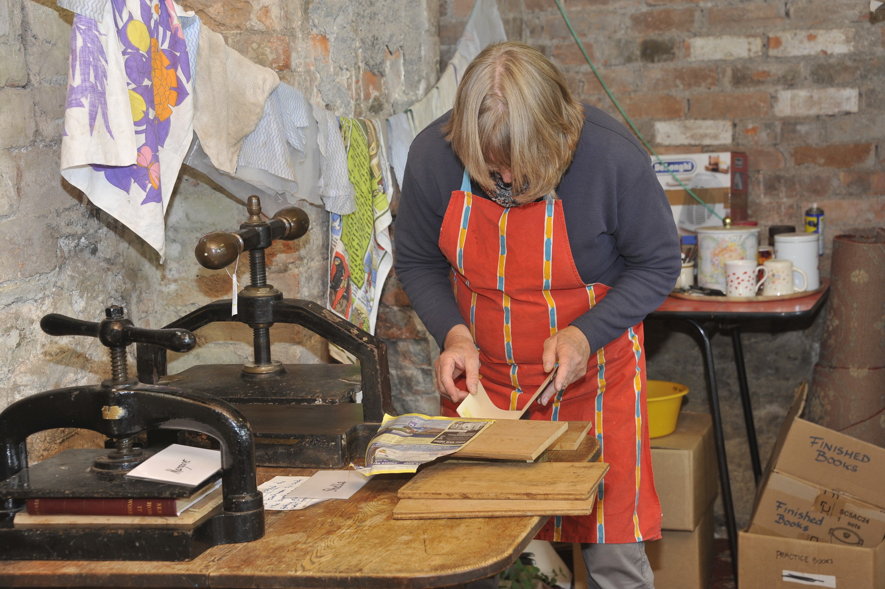 Members of the bookbinding team lovingly restore worse-for-wear books at our very own bindery...