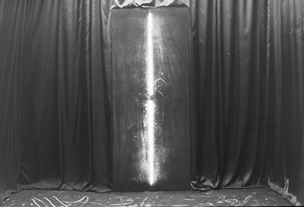 (mixed media: black satin, neon light, charcoal dust etc.)