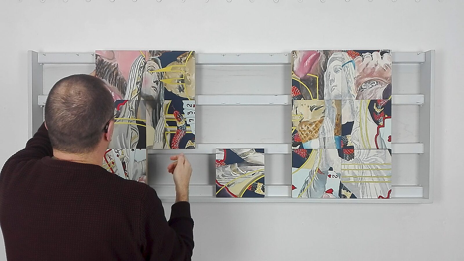 Variations with Two Marys — action videostill: the composition splits into two separate images, each built from multiple panels, while a smaller panel remains suspended between them.
