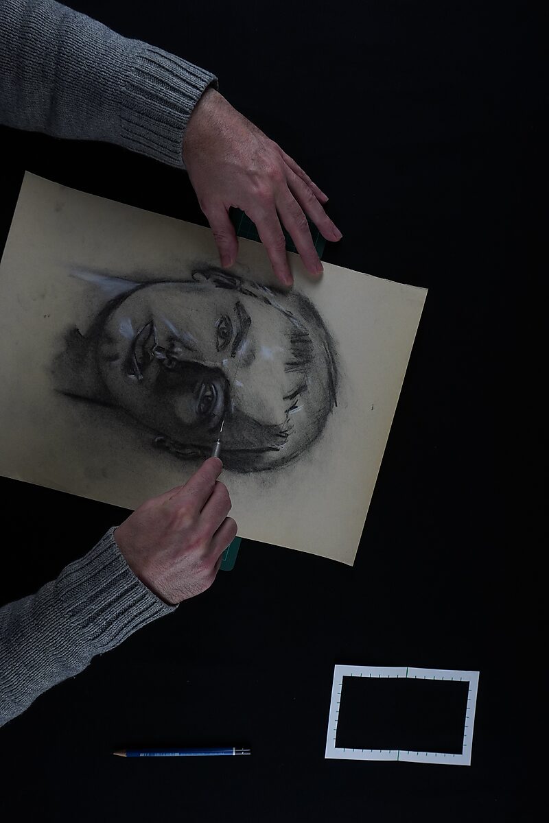 Naming–Value Butterflies — process drawing: self-portrait study 2 PHIKO (1993), Captured (2025) — hands cut with a knife along the frame around the eyes in the self-portrait.
