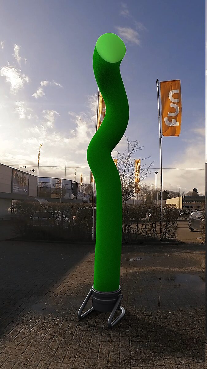 Resistance of a Skytube — videostill in which the skytube twists further upward while the flags in the background move forcefully.