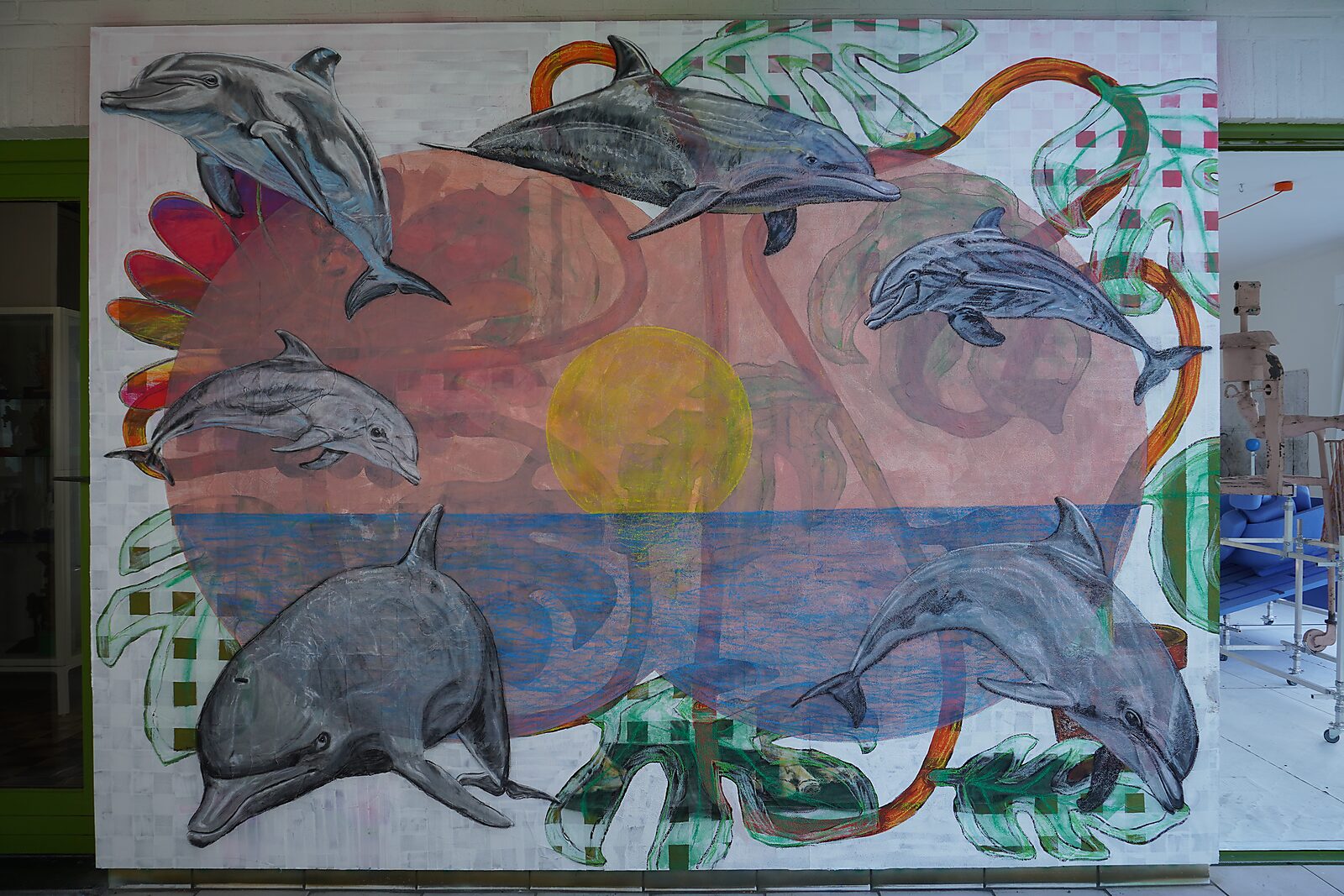 Drawing in Motion — videostill of the same scene with dolphins while a large yellow circle appears in the center like a sun above a blue horizon.