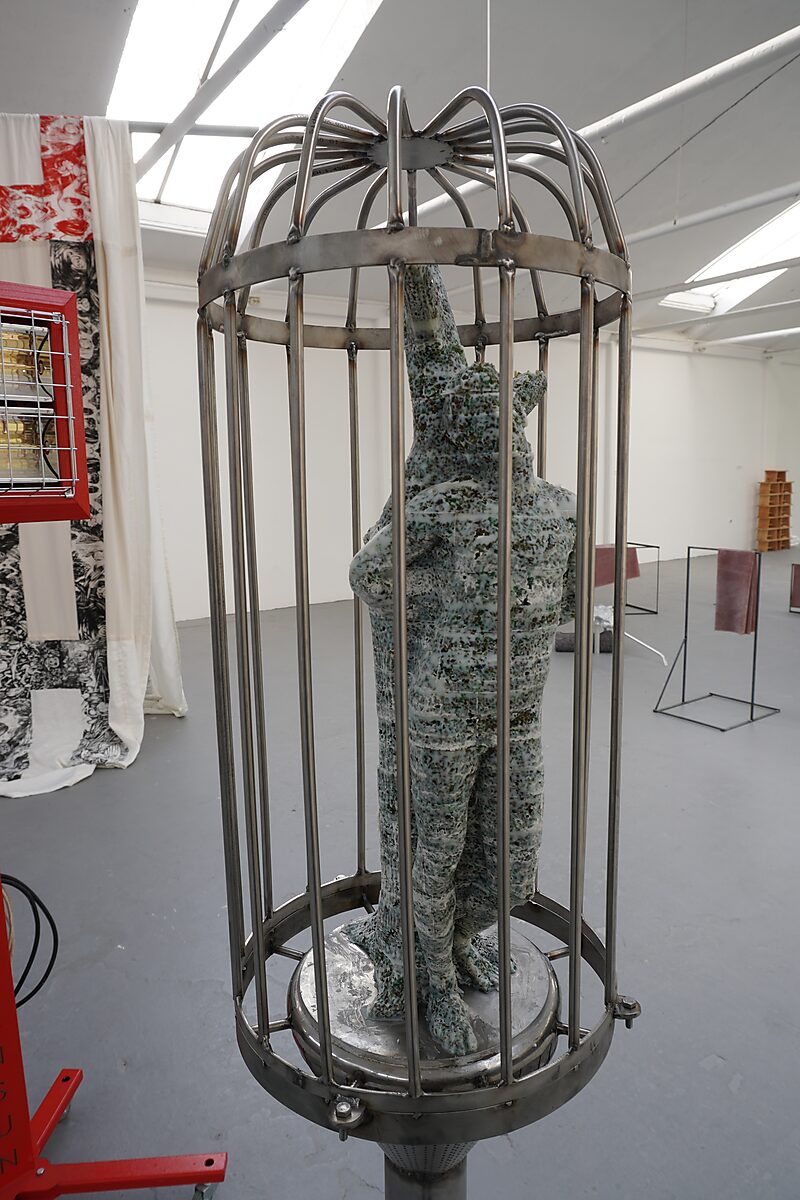 The Great Escape of Saint Sebastian — first installation at the exhibition Malabou in Malibu at De Fabriek in Eindhoven: the sculpture made of fat and glass beads stands inside a metal cage.
