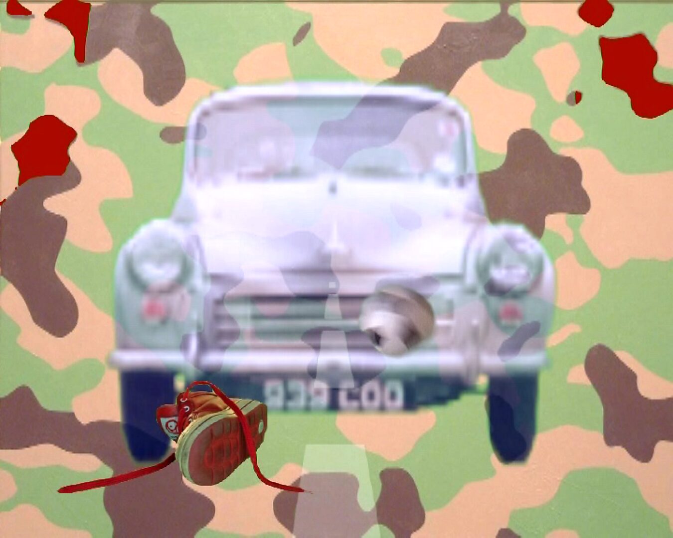 Beweging en verstilling — Kinderen dragen geen camouflage — videostill waarin een rode kinderschoen voor de auto verschijnt terwijl een voetbalvorm langs de rechterzijde beweegt.