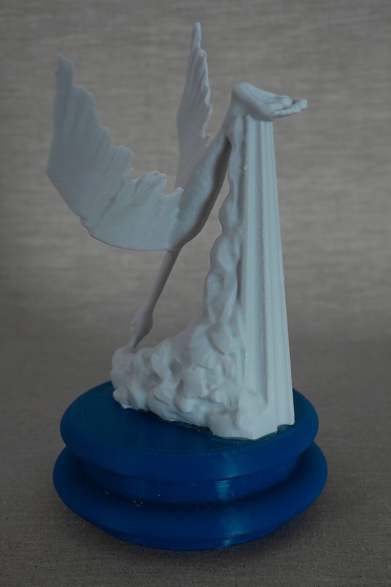 The Columns of Ovidius — Cycnus — side view of a bird form with an extended wing and elongated neck next to a column form on a blue pedestal.