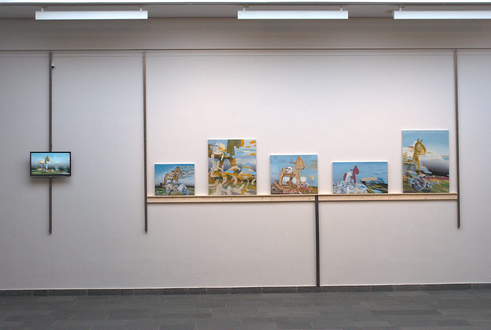 ‘Pro-Life’: Tentoonstellingszicht met reeks schilderijen op een wandplank en klein videoscherm links, CC De Adelberg, Lommel, 2015.