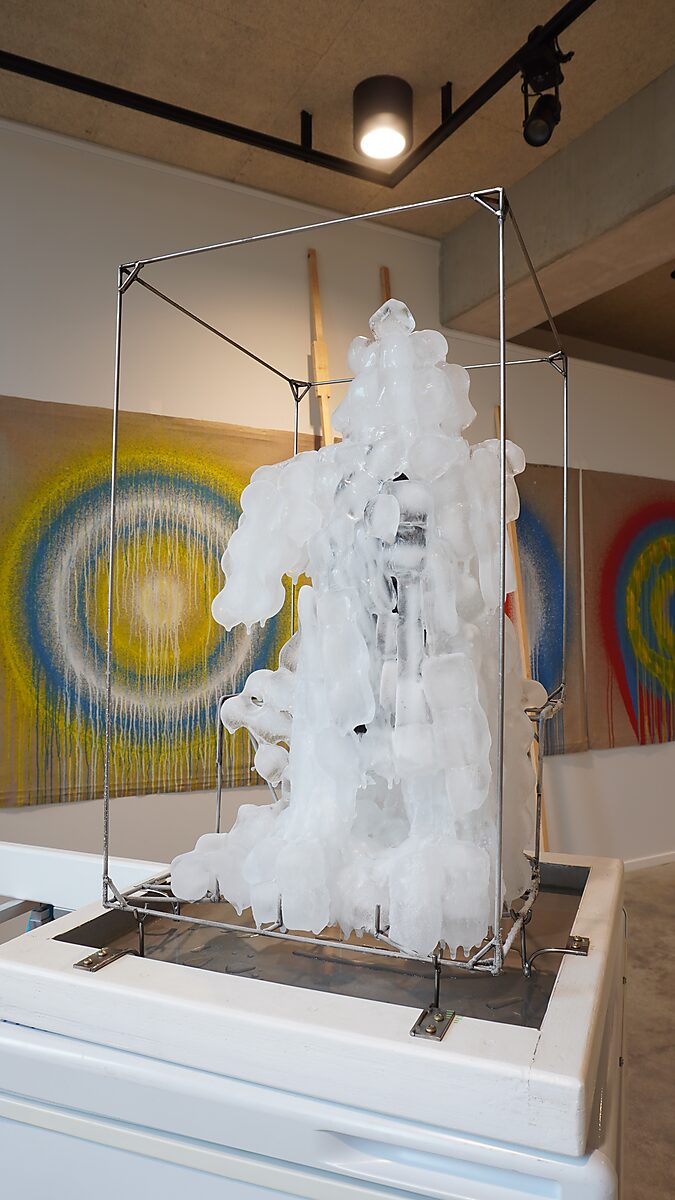 Entropic Sculpture No. 2 — Transformation Studio No. 1: Warm or Cold, growing mass of ice around the metal frame on the freezer in the exhibition space.