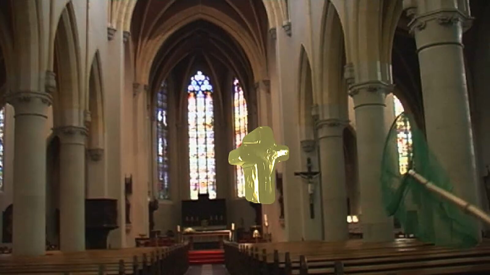Choose and Change, The Catcher of the Cross — video stills: view of a church nave with high vaults and stained glass windows, a golden cross floats centrally as a green net approaches.