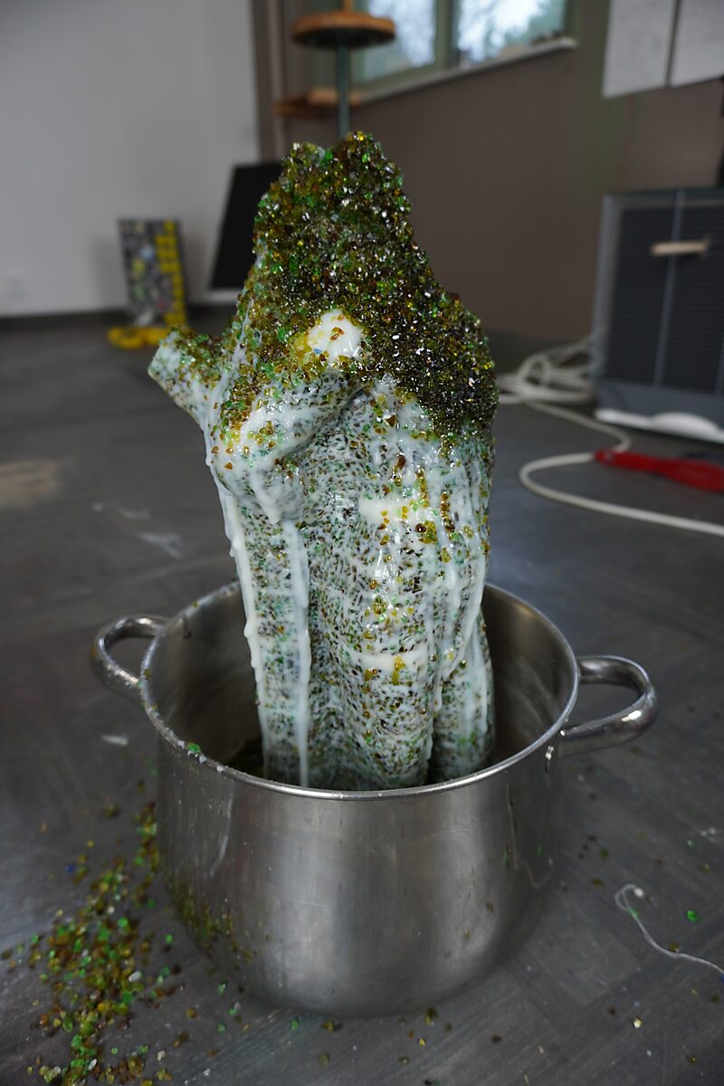 The Great Escape of Saint Sebastian — process photo: experiment in which the fat sculpture with glass beads is heated in a pot so the material begins to melt and flow.