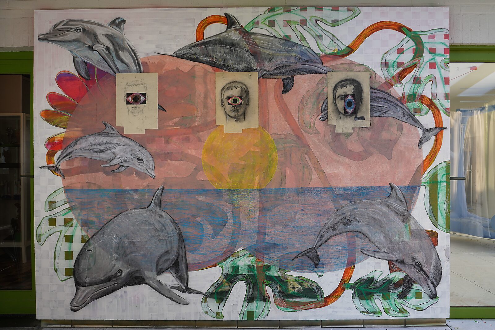 Drawing in Motion — videostill where graphic eyes with colored shapes appear inside the openings of the portraits.