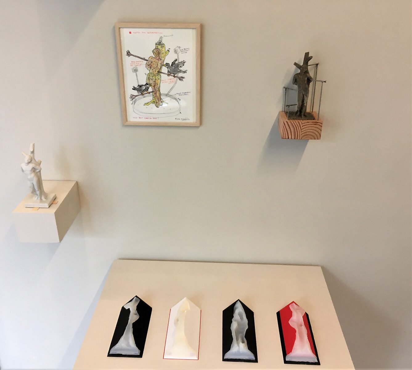 ‘I know why the caged bird sings: Exhibition view with a four-part mould: four panels with transparent silicone forms; small sculptures on wall shelves and framed drawing above, St. Sebastiaen, WARP, Sint-Niklaas, 2022