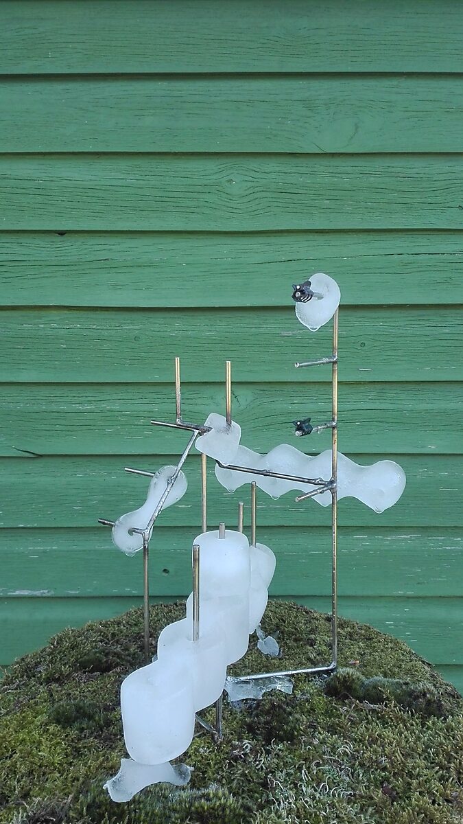 Entropic Sculpture No. 1 — videostill of the sculpture in spring where ice forms begin to melt and deform along the metal frame.