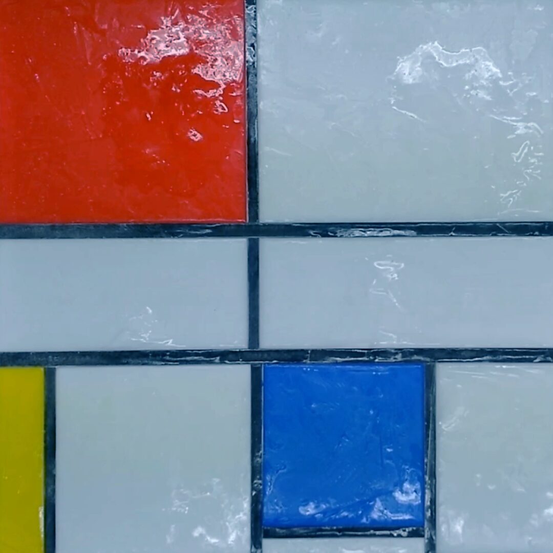 Back to Nature with Piet Mondrian No. 1.2 — process photo of coloured ice blocks placed in a Mondrian-like grid; red and blue fields begin to melt on a white surface.
