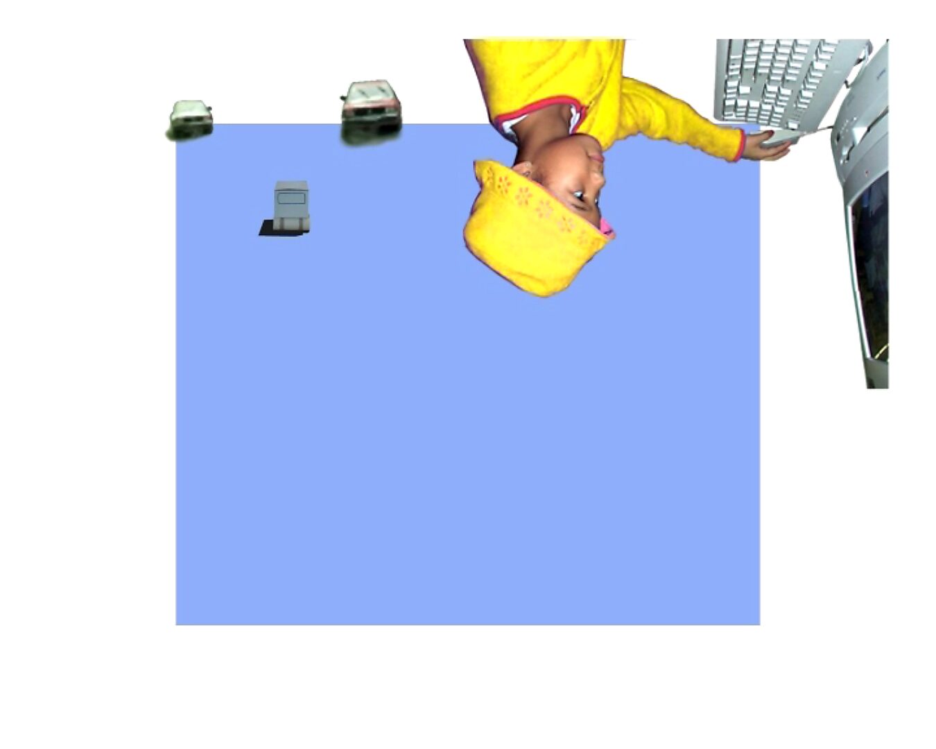 Movement and Stillness — Freedom of Imagination — video still in which the image partly rotates; the girl and the computer appear upside down while vehicles move across the blue field.