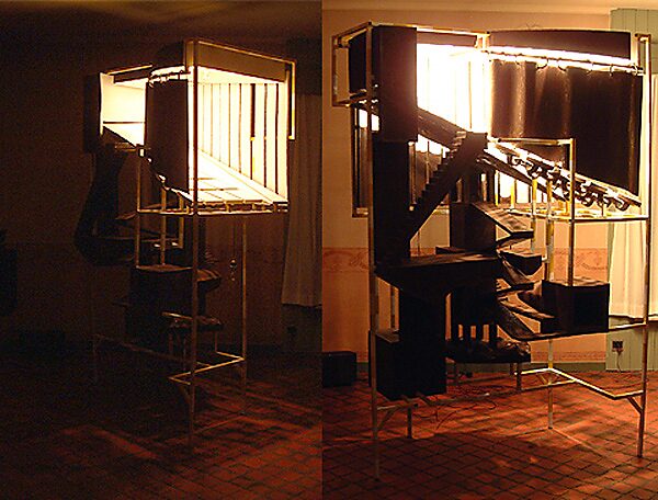 Construction with Blue — studio installation view during the construction phase, with activated lighting and visible structural elements preceding the final exhibition version.
