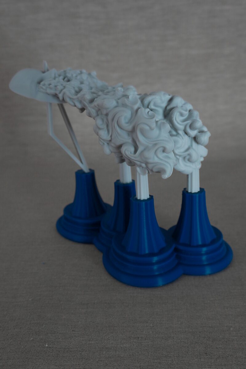 The Columns of Ovidius — Byblis — 3D-printed sculpture with an elongated organic form covered in swirling textures, supported by multiple white columns on blue pedestals.