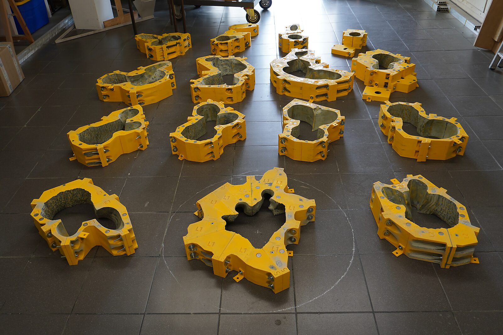 St. Sebastian with Birds No. 3 — process photo showing the separate rings of the large modular mould laid out on the floor.