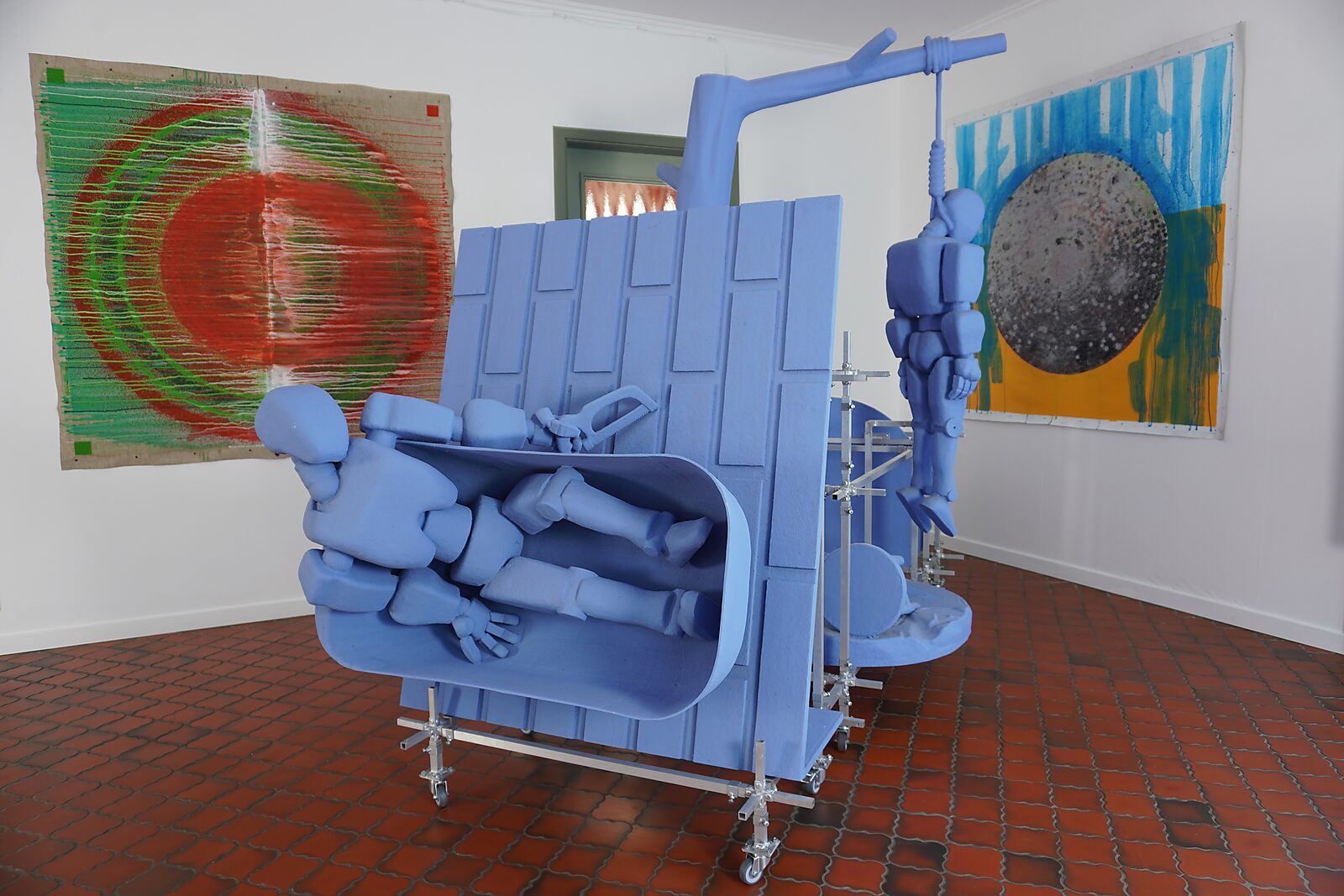 The Divider — process photo: the canvas set up in the studio next to other works and sculptures.
