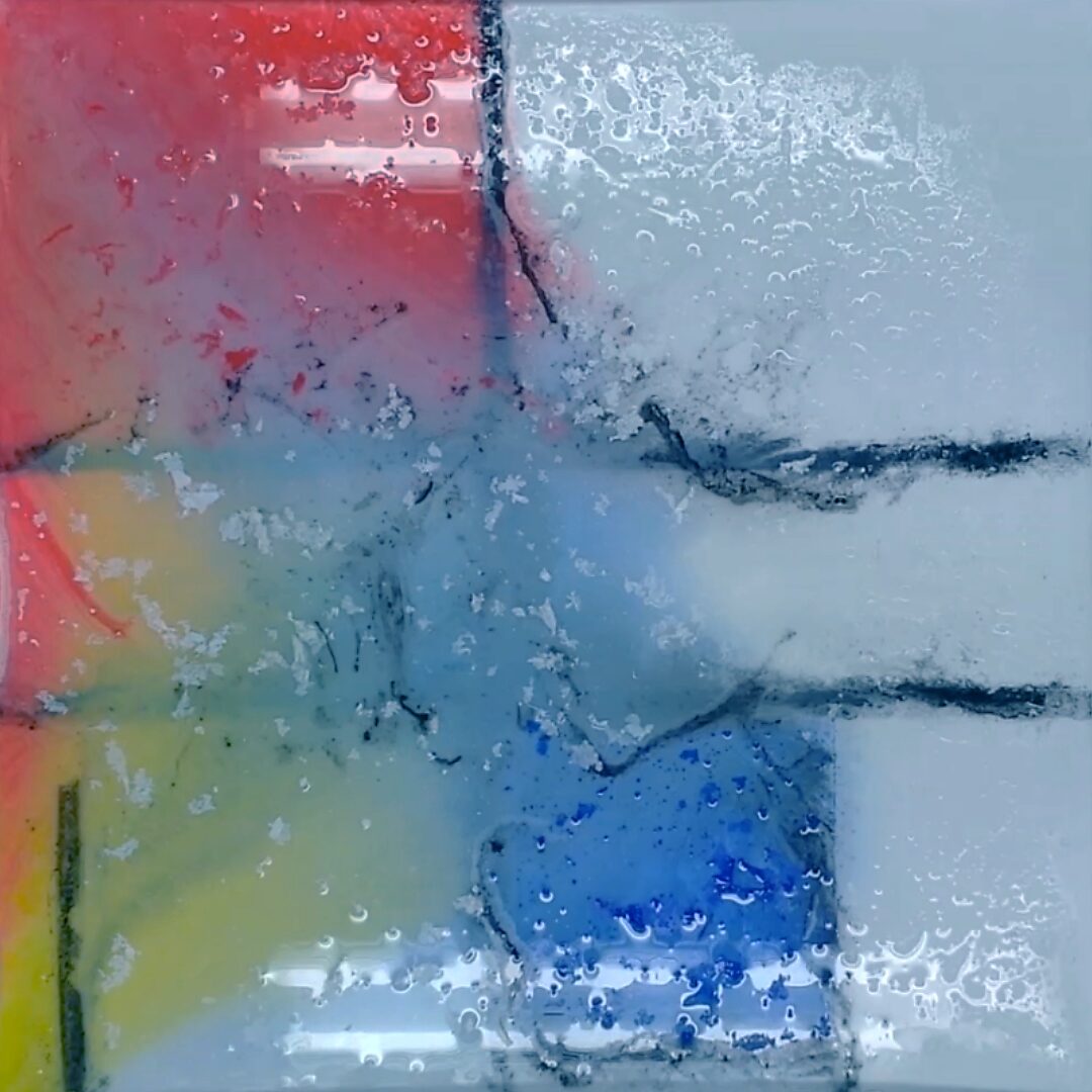 Back to Nature with Piet Mondrian No. 1.2 — process photo where the ice is largely melted; blue pigment gathers in one section while other colours diffuse.