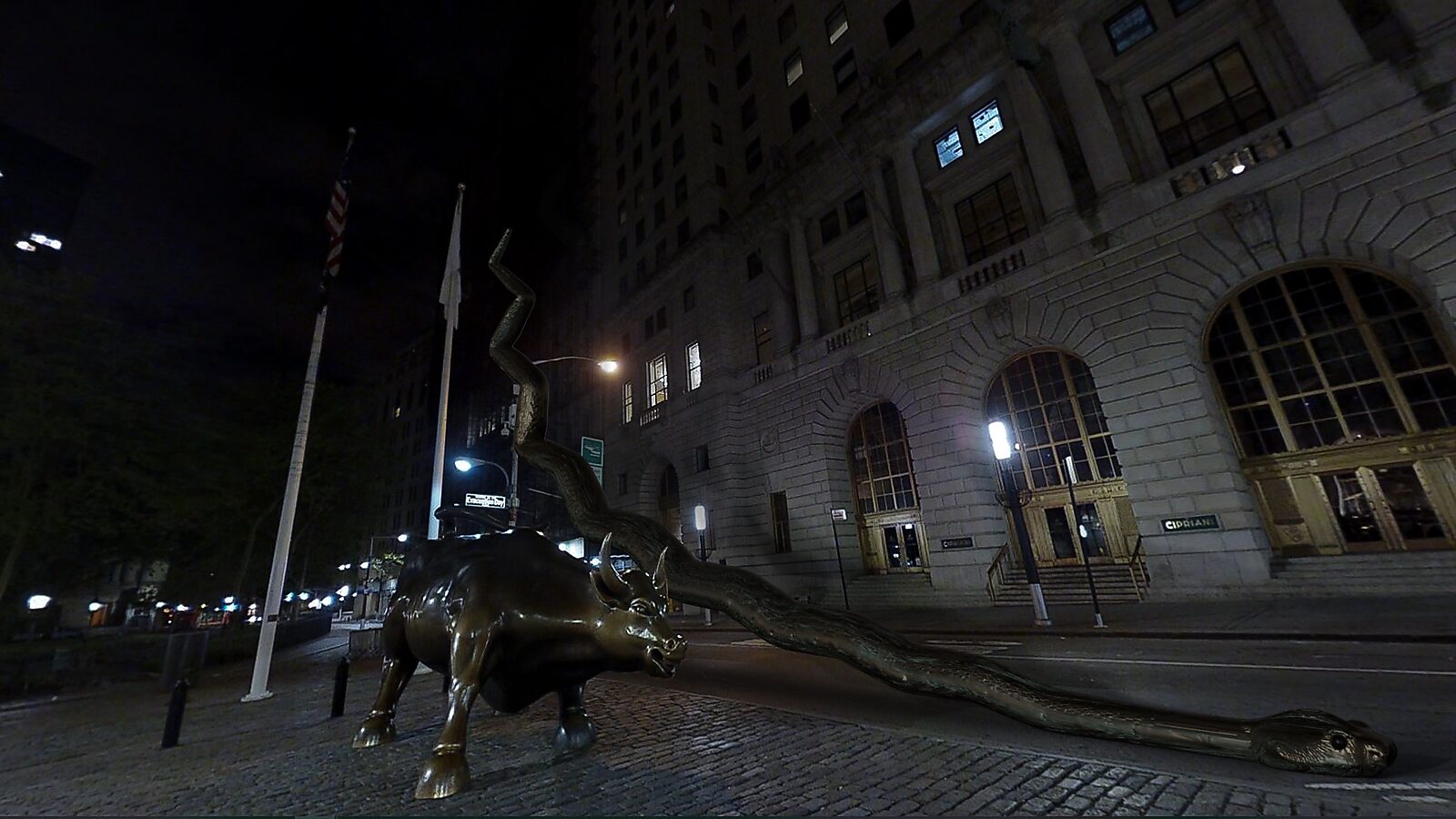 The Serpent’s Staircase — videostill from a 3D animation: beside the bronze Wall Street bull in a nighttime city street, a long serpent emerges from the sculpture and stretches across the square.