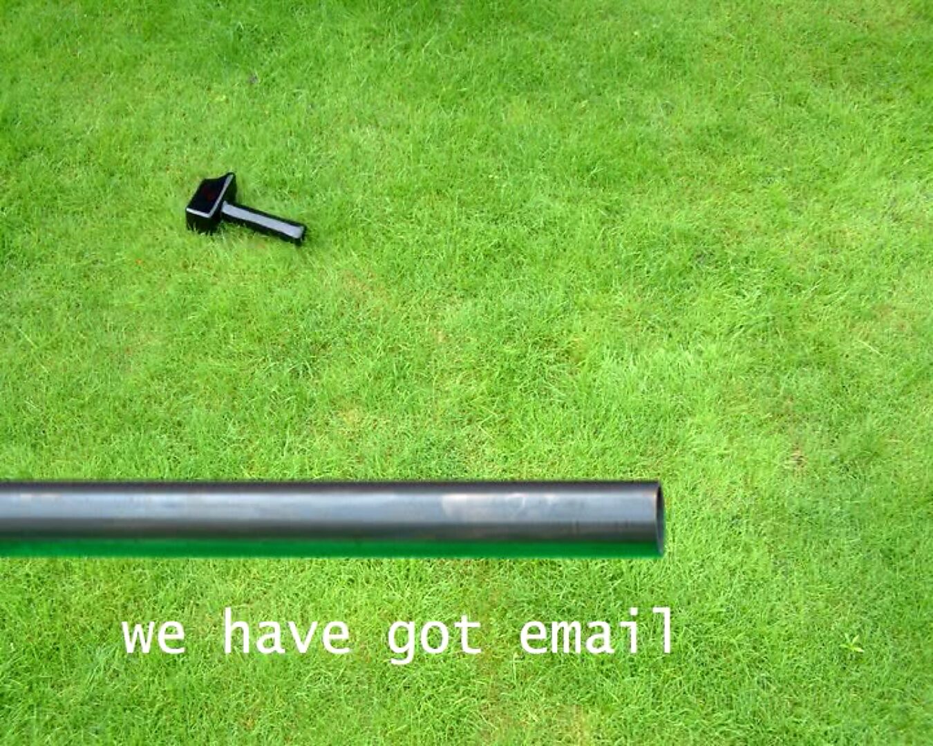 Choose and Change, The Distance to Morsmaille and Back — video stills: black hammer lying further away on grass, with a metal pipe in the foreground and white text “we have got email”.