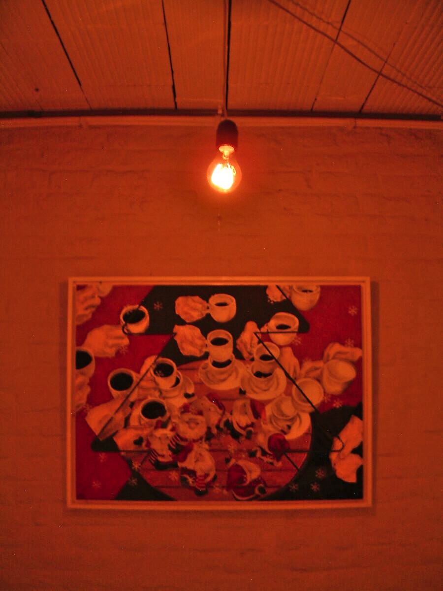 ‘Smaak’: Wall with painting of coffee cups under warm incandescent light; red-tinted atmosphere in the space, CC De Breughel, Bree, 2005