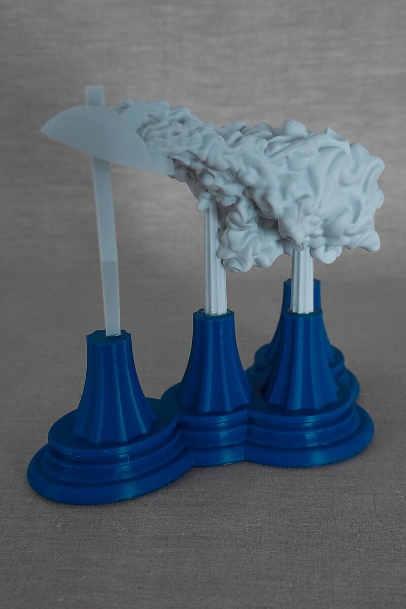 The Columns of Ovidius — Byblis — opposite side view of an organic 3D-printed form supported by multiple columns on blue pedestals.
