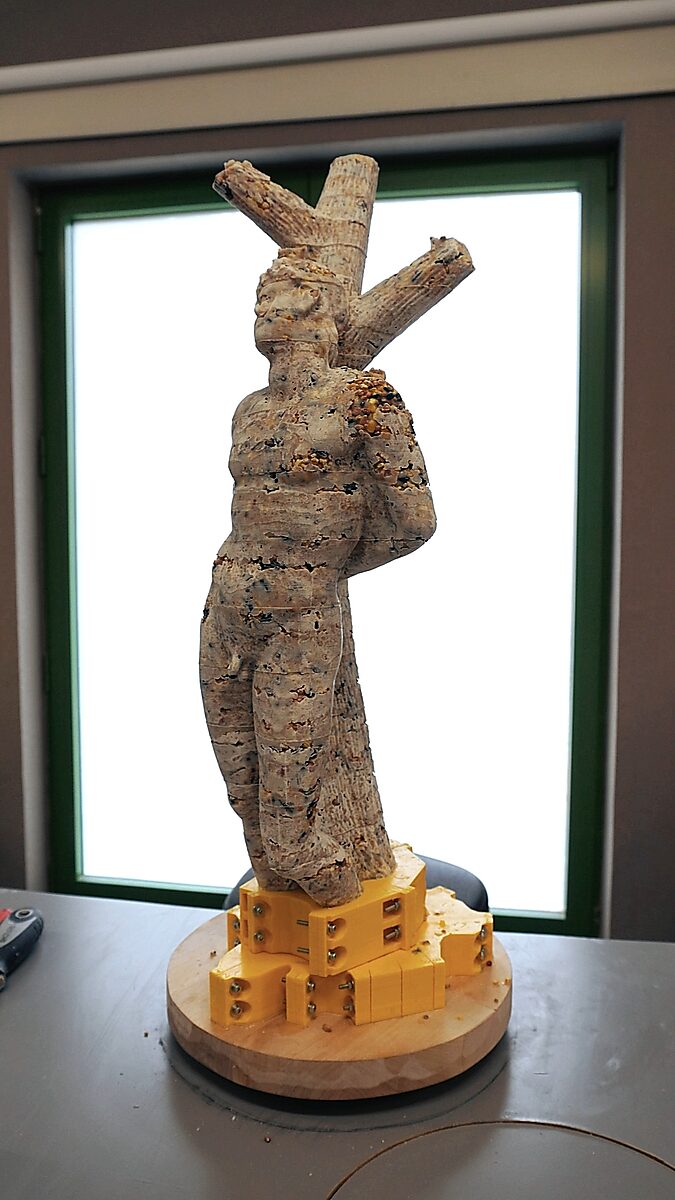St. Sebastian with Birds No. 2 — video still in which the cast figure is largely released from the mould and remains visible on the base.