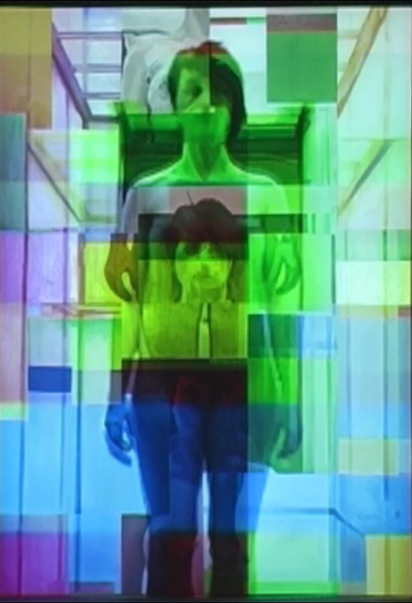 Living Canvas — Nu descendant par un ascenseur — video still in which the body remains partially visible while green and blue colour planes dominate the image.