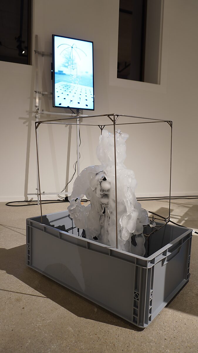 Entropic Sculpture No. 2 — Transformation Studio No. 1: Warm or Cold, ice structure placed in a container collecting the meltwater of the sculpture.