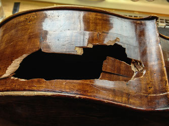 Cello with badly damaged upper bout rib