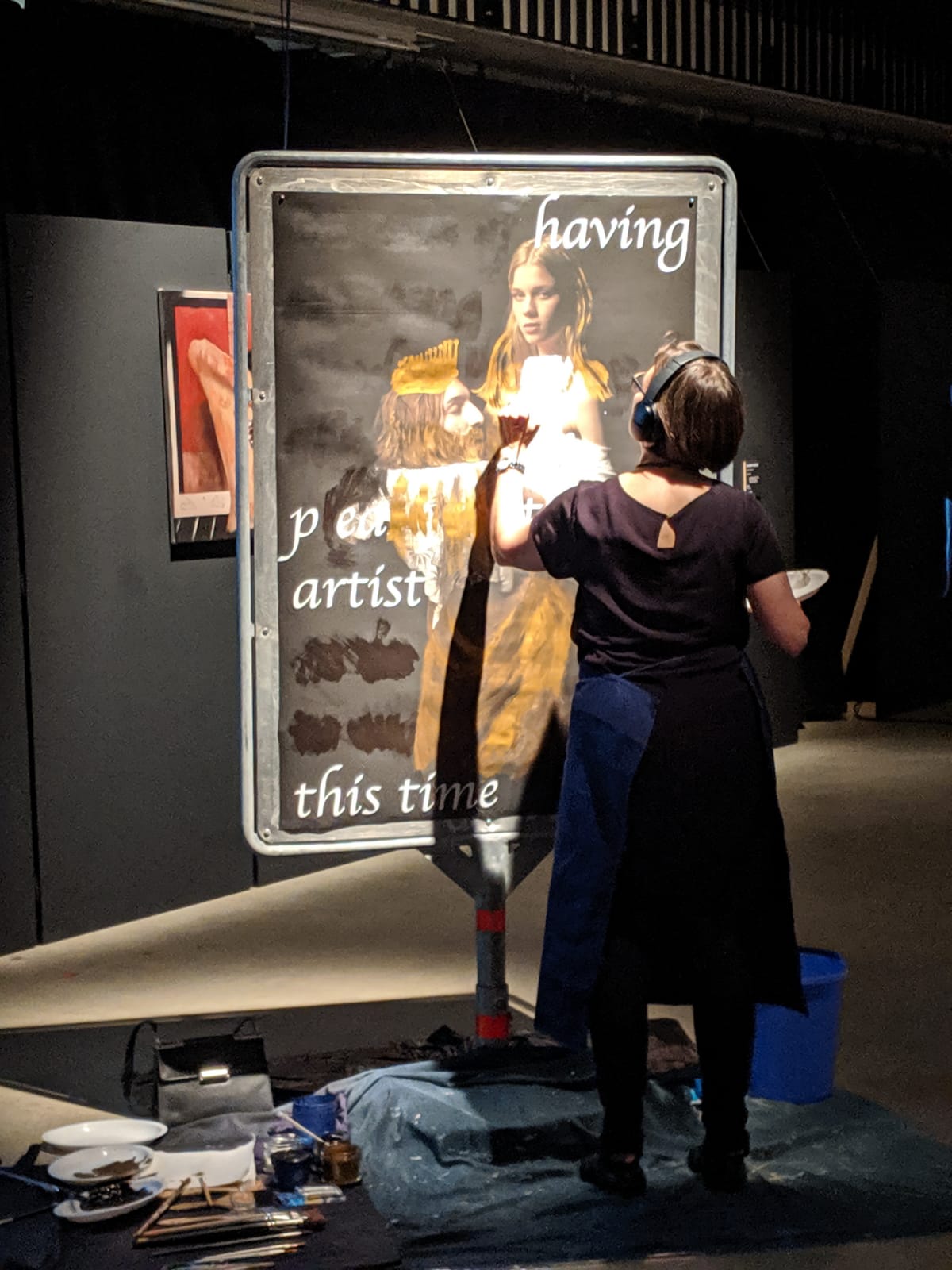 Marianne Iten Thürig "destroying" the poster Salome II of the artist Denys Shantar.