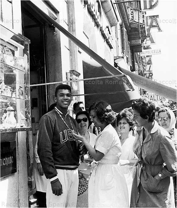 Cassius Clay on Via Veneto central strreet of Rome, showing the gold medal he won at the 1960 Rome Olympics, (Associated Press)